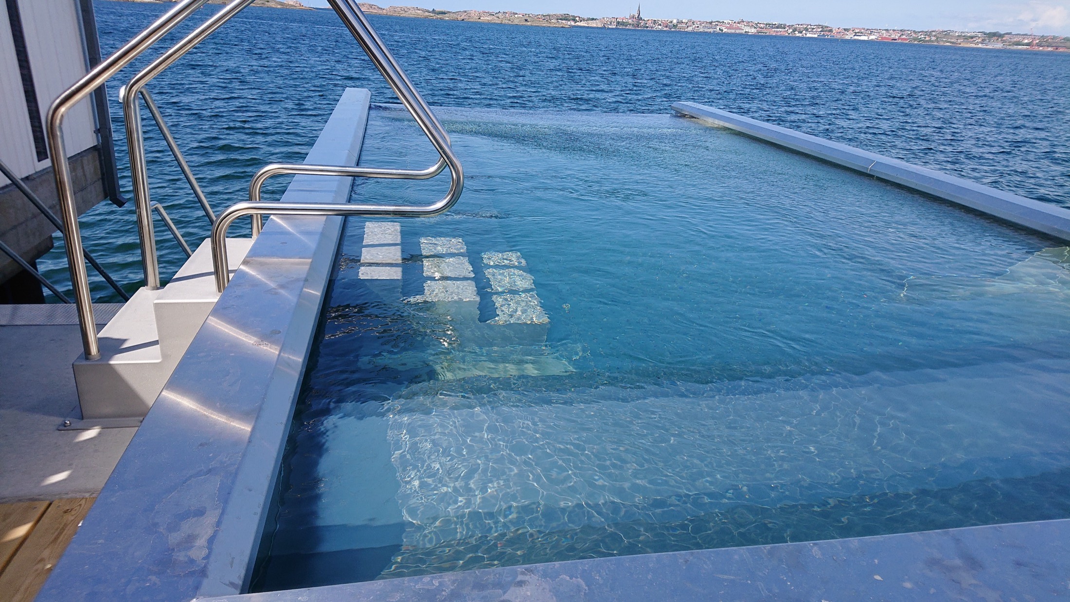 Stainless steel infinity pool overlooking the sea