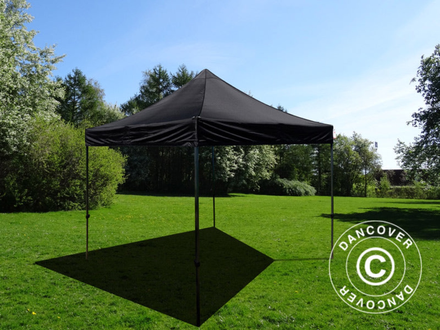 Black FleXtents Basic folding tent on a lawn