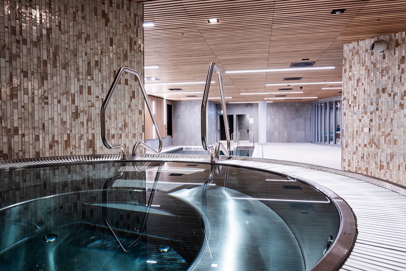Indoor stainless steel spa pool with loungers